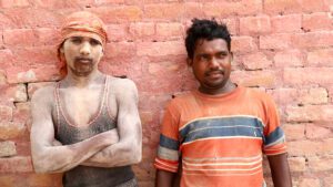 Workers take a moment of respite at a brick kiln site.