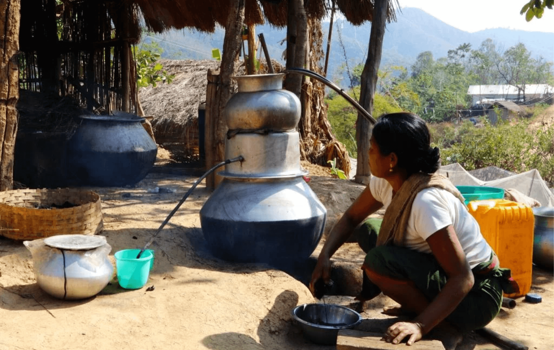 A woman from Andro brewing a local alcohol for sale | Photo by Simit Bhagat